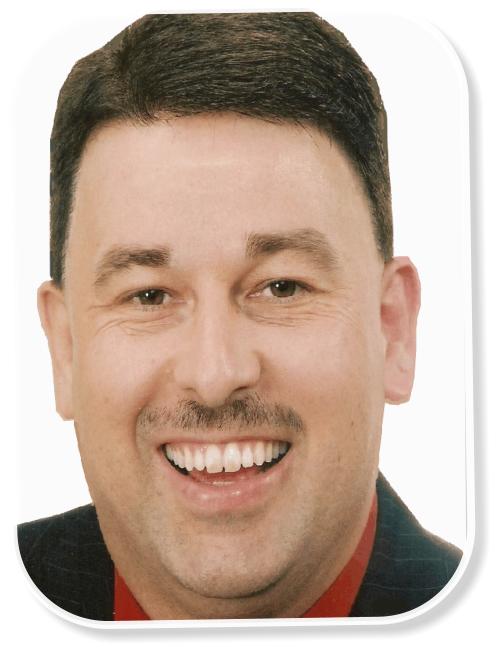 Portrait of Brian Burchfield in a black jacket and red shirt