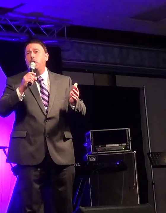 Brian Burchfield singing on stage