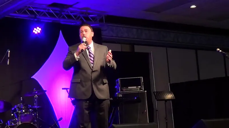 Brian Burchfield singing The Family Circle on stage